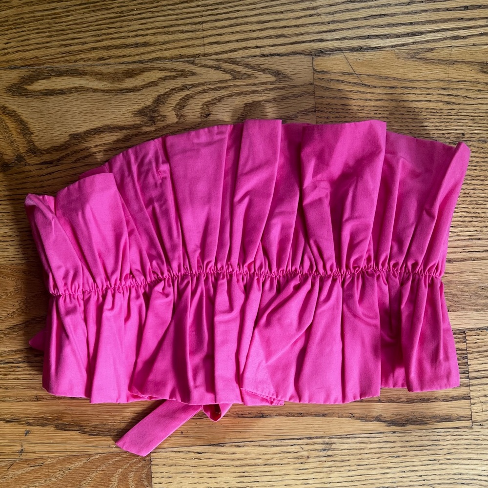 Cute pink ruffled top that ties in the back